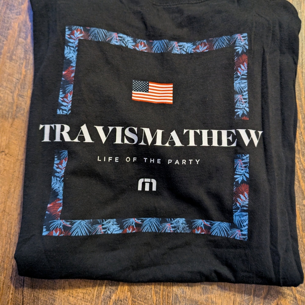 Travis Mathew Black Graphic Tee with Blue and Red Accent